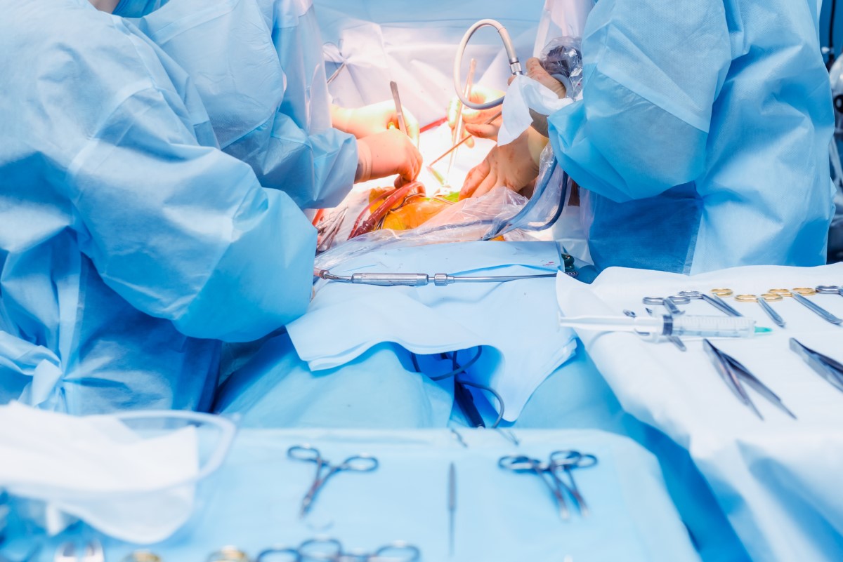 Surgical treatment - abdominal surgery and doctors and paramedics in the operating room operate on the patient