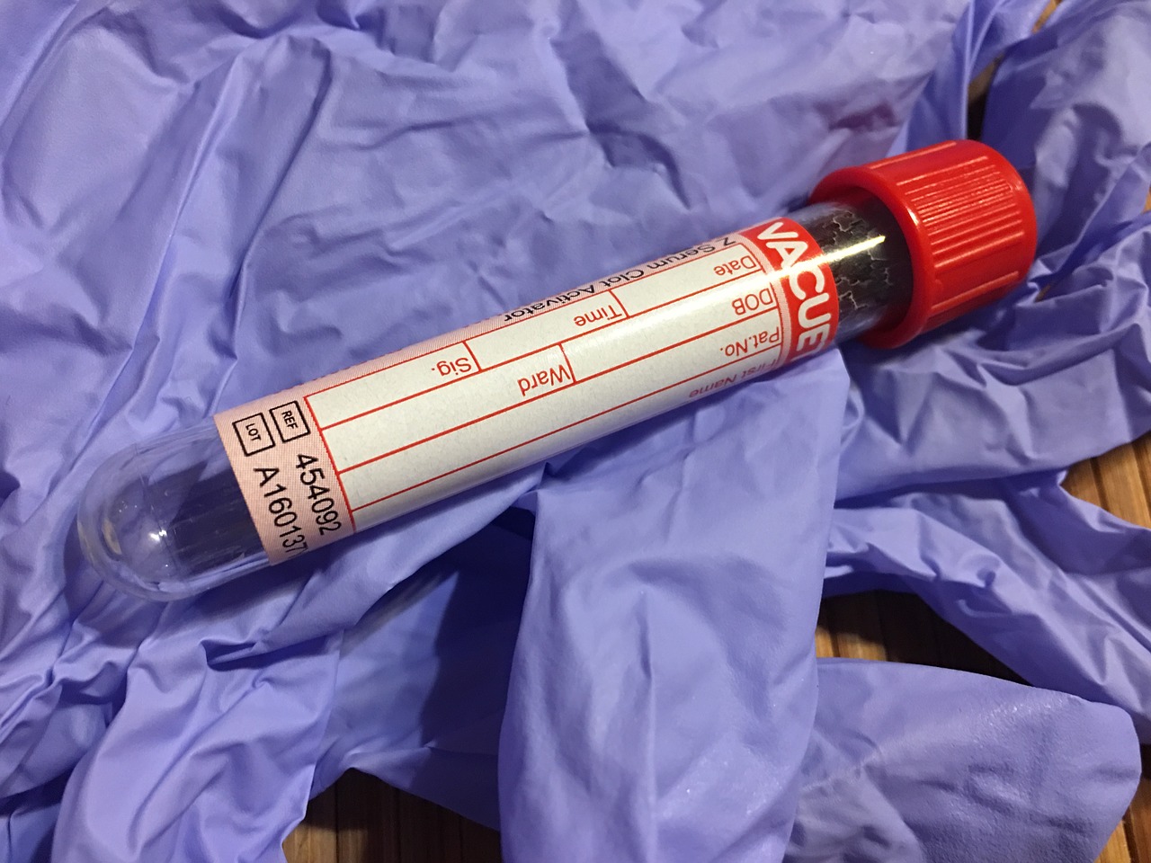 Blood test tube, glove