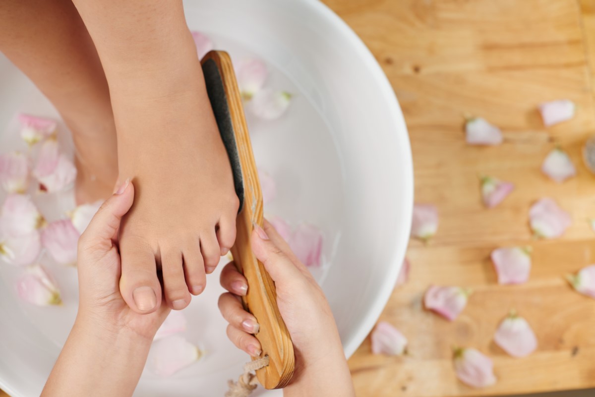 Pedicure, foot treatment and trimming with a firming brush