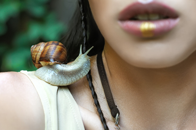 snail on the woman's shoulder