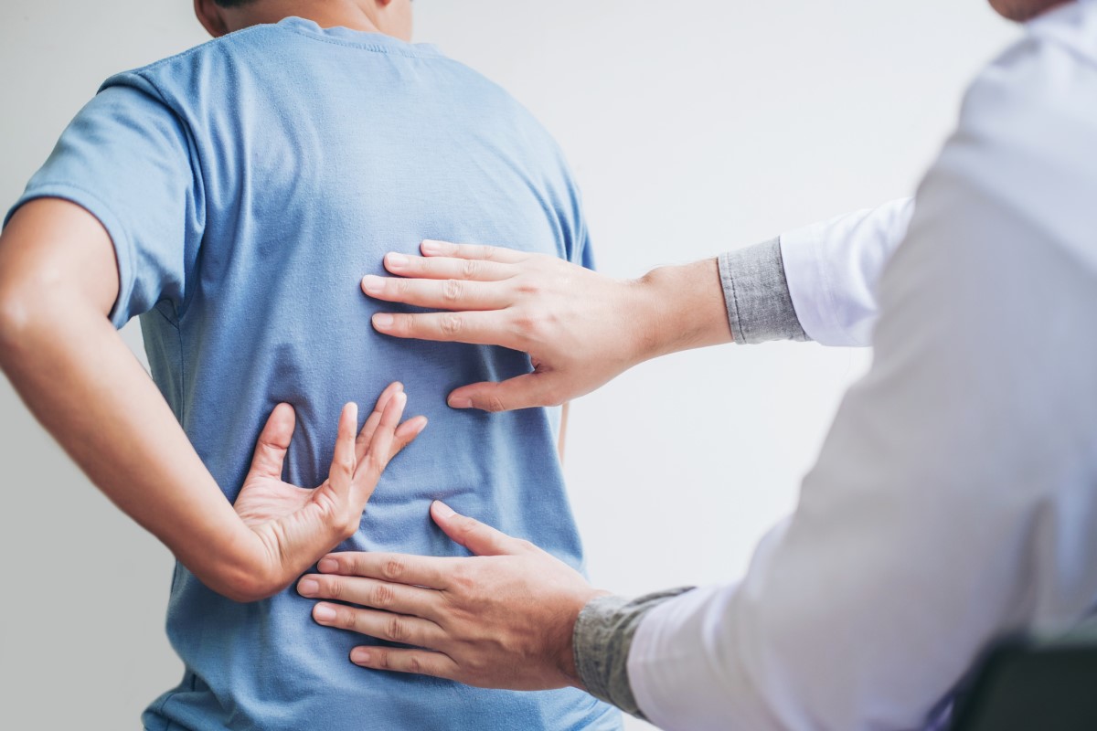 Doctor and patient address back pain