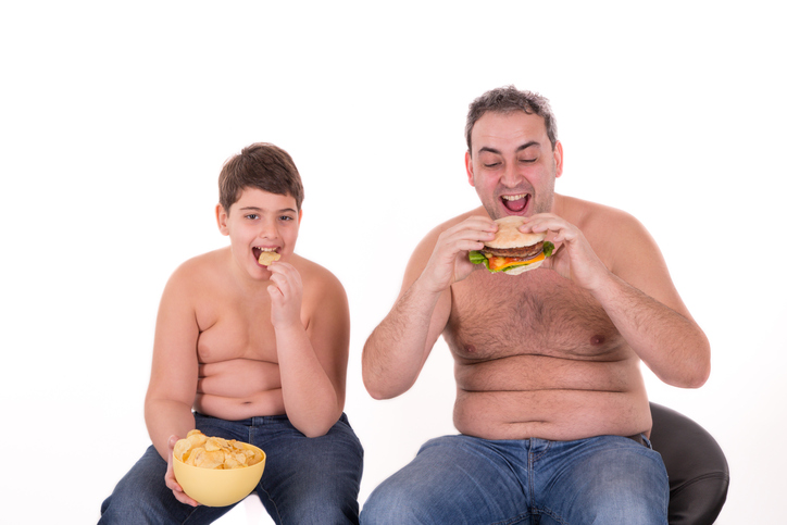 the boy and his dad eat the wrong food, eat hamburger, are obese