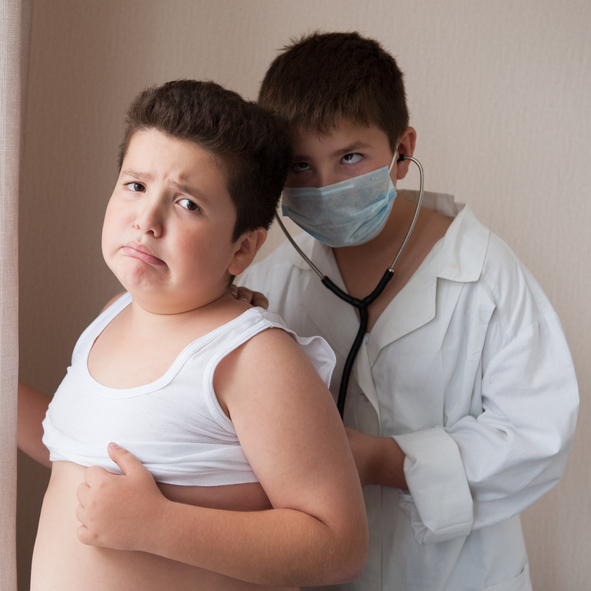 Children play doctor and patient, examine breathing, boy is obese