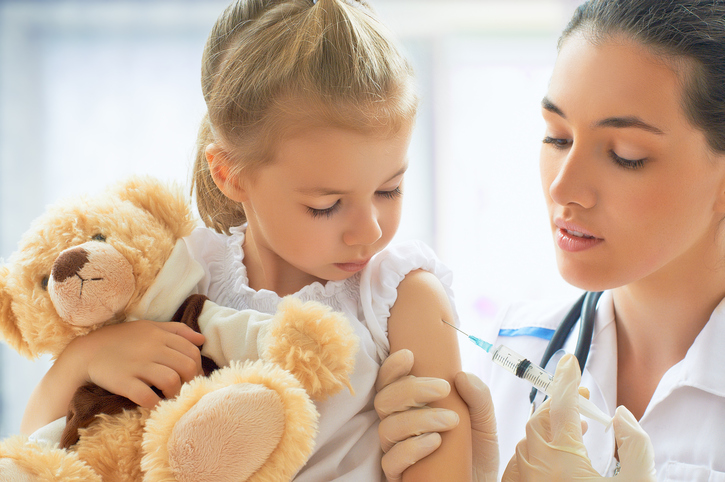 Vaccinating a child with a stuffed animal