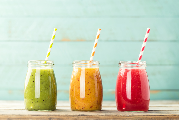 Three coloured fruit smoothie straws - green, yellow and red