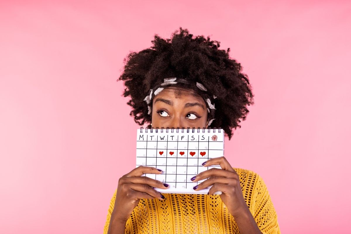 Woman holding a menstrual calendar
