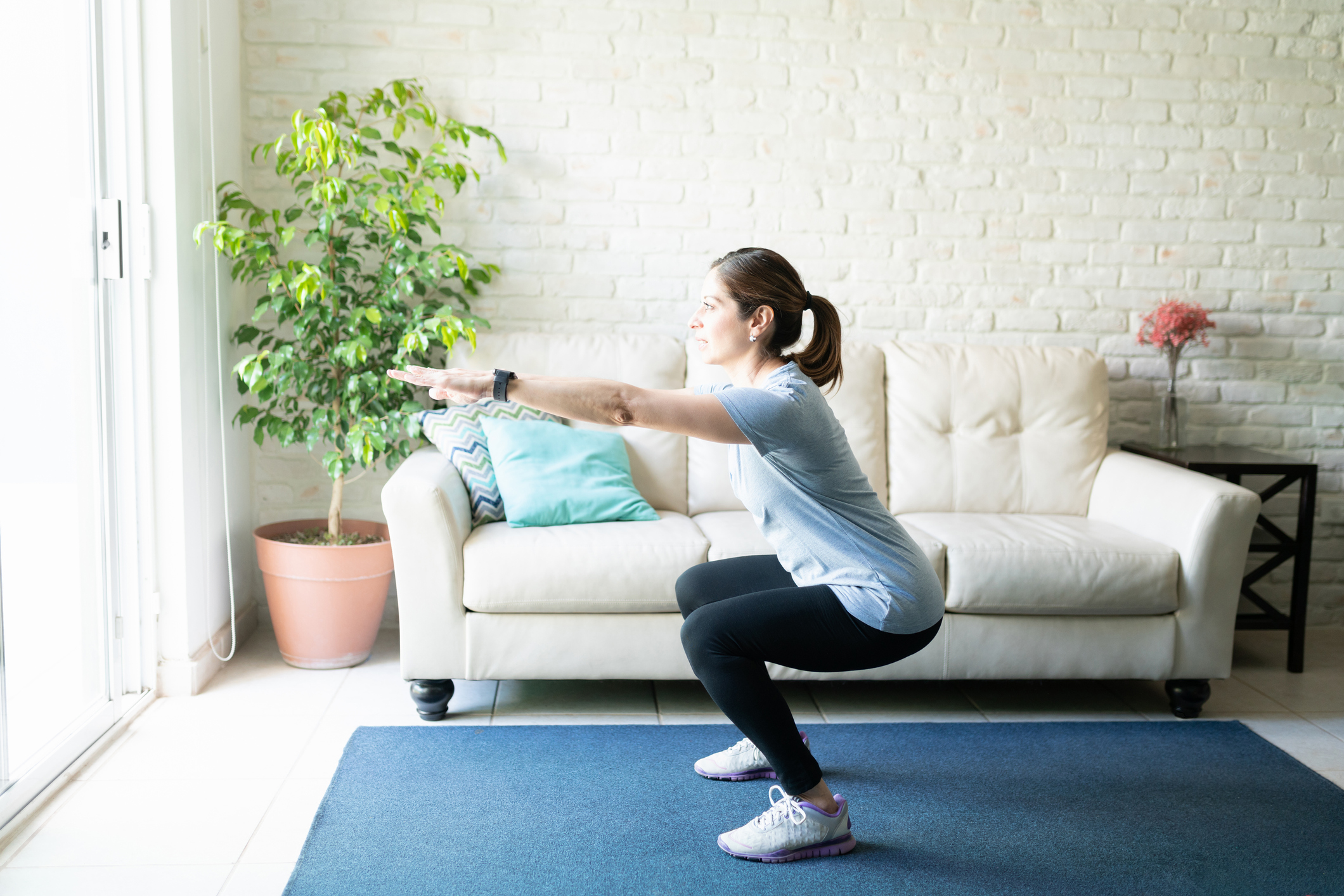 The harder version of this exercise is with the arms extended. Source: Getty Images