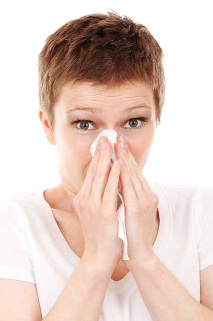 Woman sniffles, has a cold