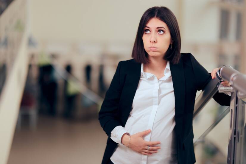 A tired pregnant woman after climbing the stairs. Source: Getty Images